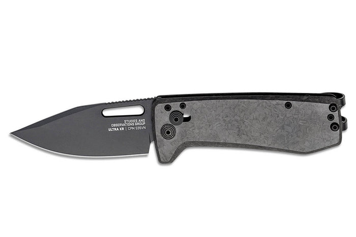 Couteau pliant SOG Ultra XR SGULTRAXRXHPBK manche en fibre de carbone noir 9,1cm