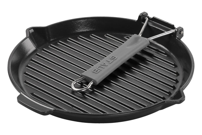 Gril rond Staub 28cm en fonte émaillée noir mat à poignée pliable