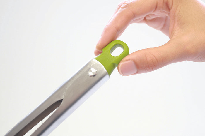 Pince Joseph Joseph Elevate en acier inoxydable et silicone avec reposoir intégré